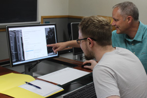 student and instructor in computer lab