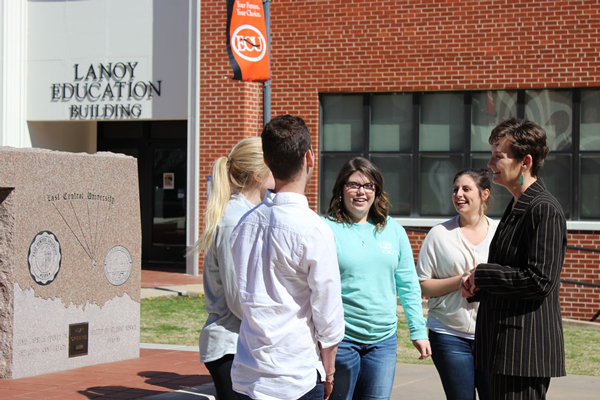 President Pierson conversing with students